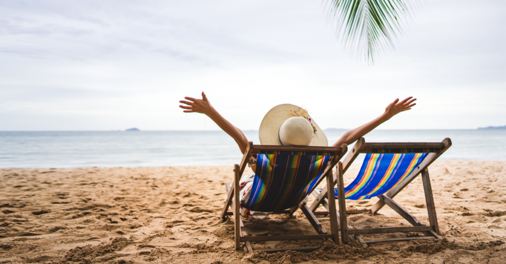 person on beach chair on beach