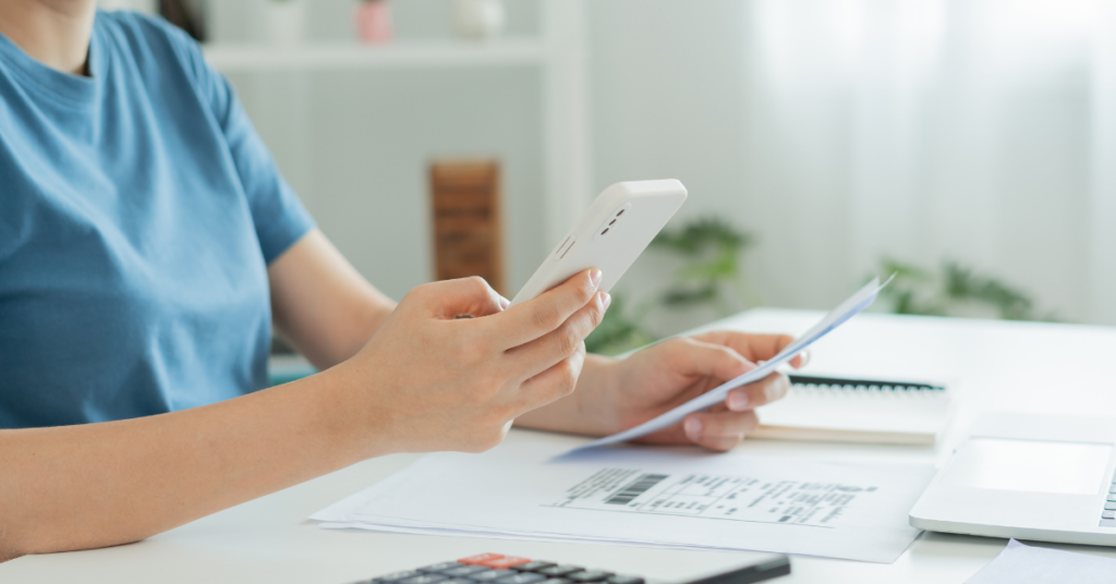 Person scanning receipt with their mobile phone.